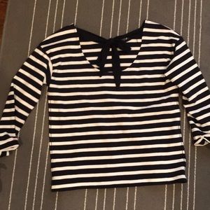 Navy and white striped shirt with bow on back